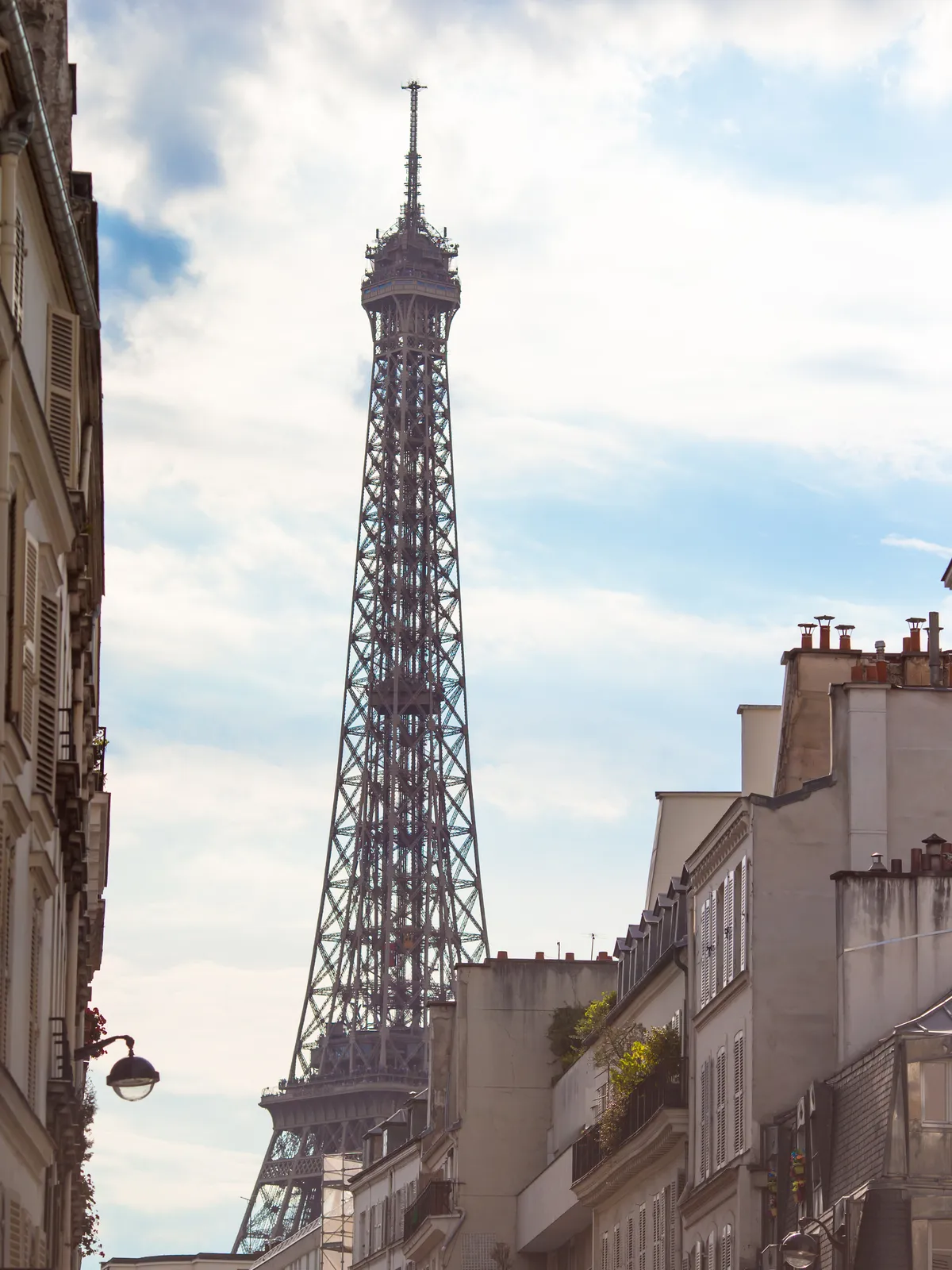 The Eiffel Tower framed by a Parisian street, Paris, France
